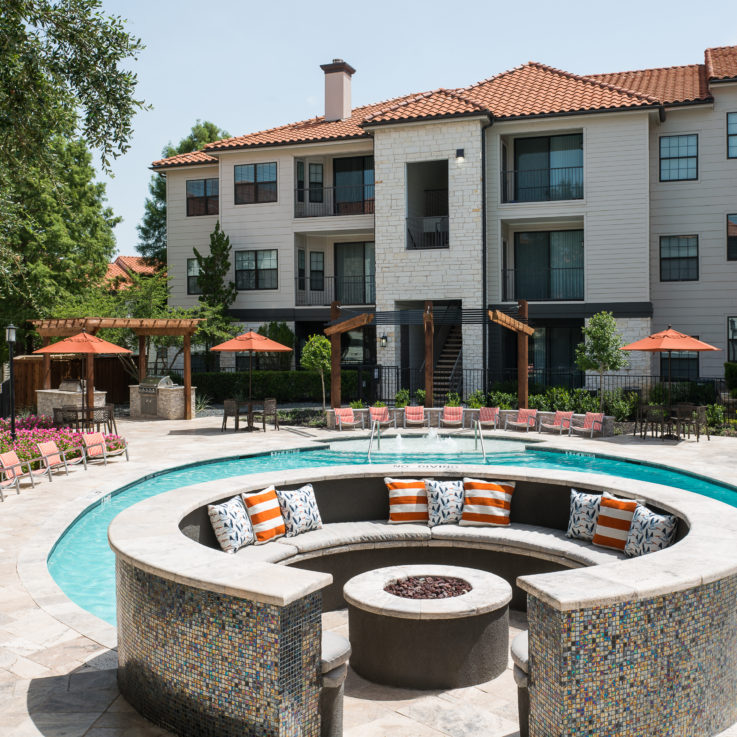 Circular seating area next to an outdoor pool